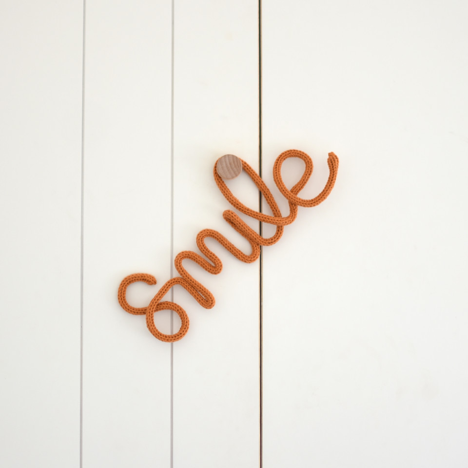 Knitted word | smile